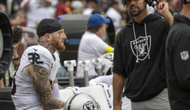 Raiders defensive end Maxx Crosby (98) speaks with defensive line coach Rob Leonard during the ...