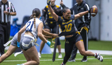 Nevada State's Brooklyn Hill (10) has her flag pulled after an interception and run back b ...