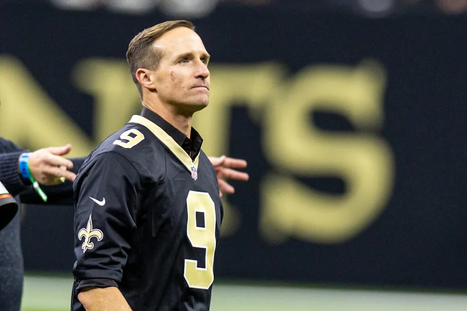 Oct 17, 2024; New Orleans, Louisiana, USA; Former New Orleans Saints quarterback Drew Brees on the field for the coin toss against the Denver Broncos during the first half at Caesars Superdome. Mandatory Credit: Stephen Lew-Imagn Images
