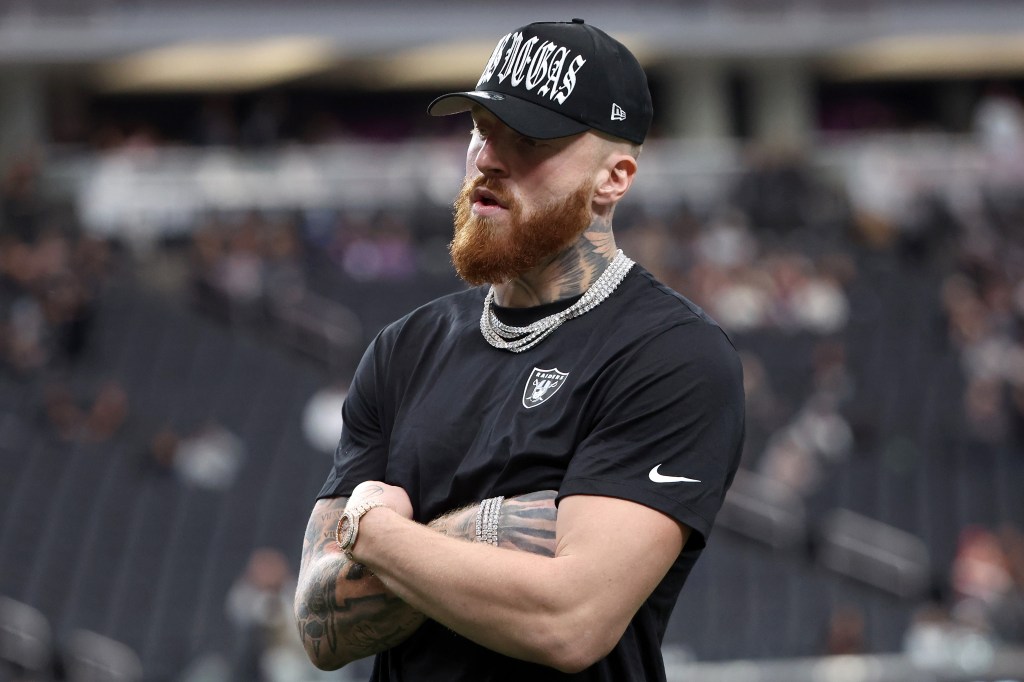Las Vegas Raiders player Maxx Crosby in a black t-shirt and baseball cap.