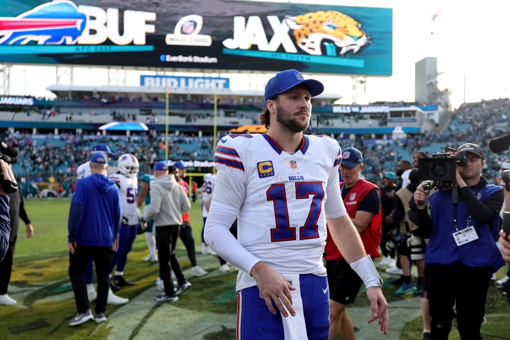 Buffalo Bills quarterback Josh Allen #17 on the field after defeating the Jacksonville Jaguars in the AFC Wild Card Playoff game.