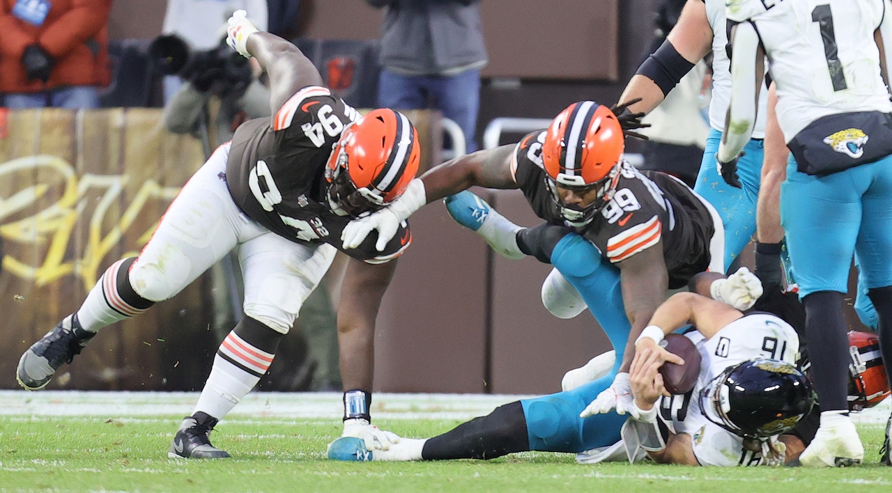 Cleveland Browns defensive end Myles Garrett sacks Jacksonville Jaguars quarterback Trevor Lawrence on a two-point conversion try with added pressure by Cleveland Browns defensive end Za'Darius Smith  and Cleveland Browns defensive tackle Dalvin Tomlinson in the fourth quarter