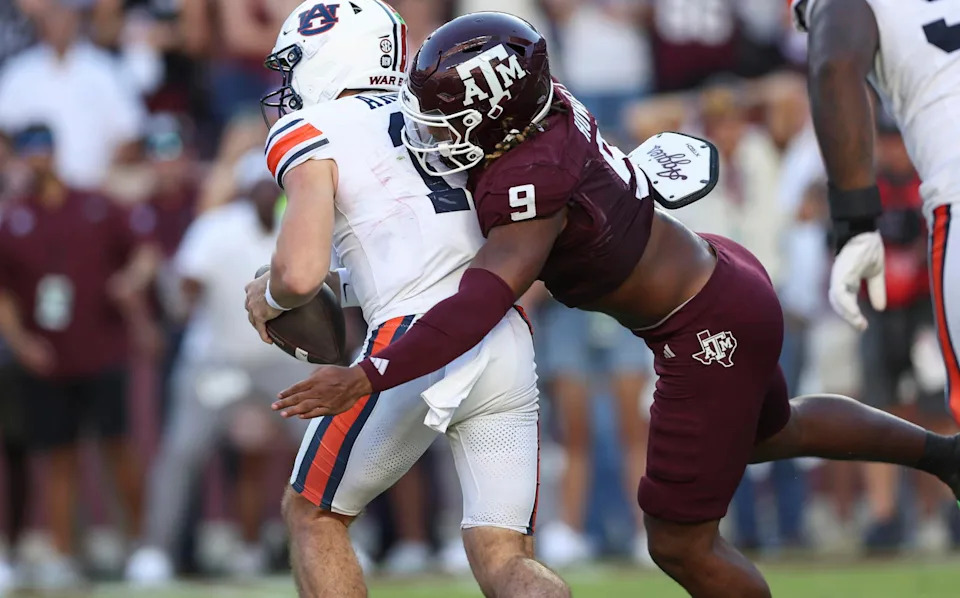 Texas A&M defensive end Cashius Howell (9) tackles Auburn QB Jackson Arnold as the Aggies host the Tigers on Sept. 27, 2025, at Kyle Field in College Station, Texas. (Troy Toarmina/Imagn Images)