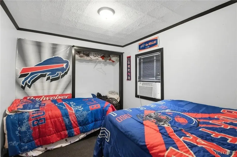 Even the bedroom features Bills gear. <span class="image-credit">(Realtor.com)</span>