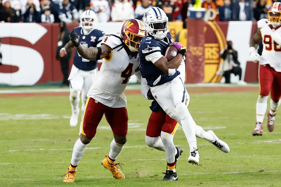 Dec 25, 2025; Landover, Maryland, USA; Dallas Cowboys wide receiver George Pickens (3) makes a catch defended by Washington Commanders linebacker Frankie Luvu (4) and cornerback Jonathan Jones (31) in the fourth quarter at Northwest Stadium. Mandatory Credit: Geoff Burke-Imagn Images