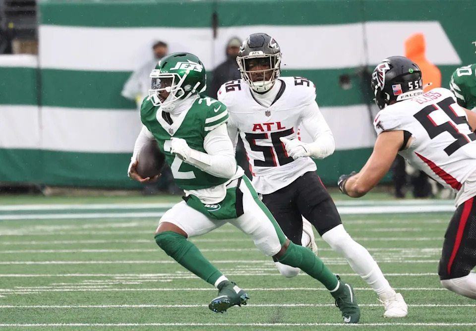 Tyrod Taylor runs the ball as Leonard Floyd gives chase during the first half of the Jets’ win over the Falcons on Nov. 30, 2025 at MetLife Stadium. Robert Sabo for NY Post