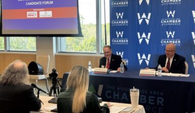 two men at a debate table