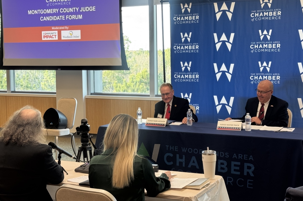 two men at a debate table