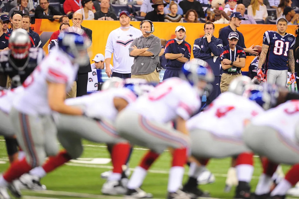 Patriots coach Bill Belichick watches from the sideline during Super Bowl XLVI against the New York Giants at Lucas Oil Stadium on Feb. 5, 2012.