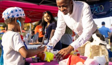 Kevin Carolina, a medical student, helps out at Jefferson Einstein Philadelphia Hospital Community Day in 2024. The event provided family fun, health screenings, and information about job opportunities at Jefferson Health.