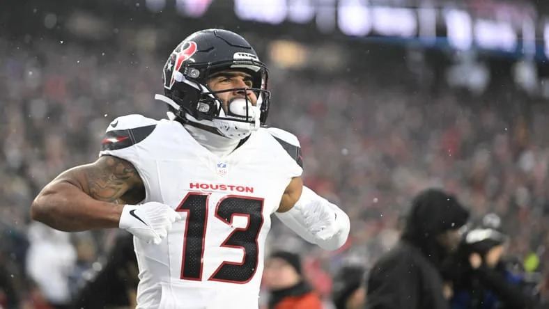 Christian Kirk celebrating a touchdown during a playoff game at Gillette Stadium.