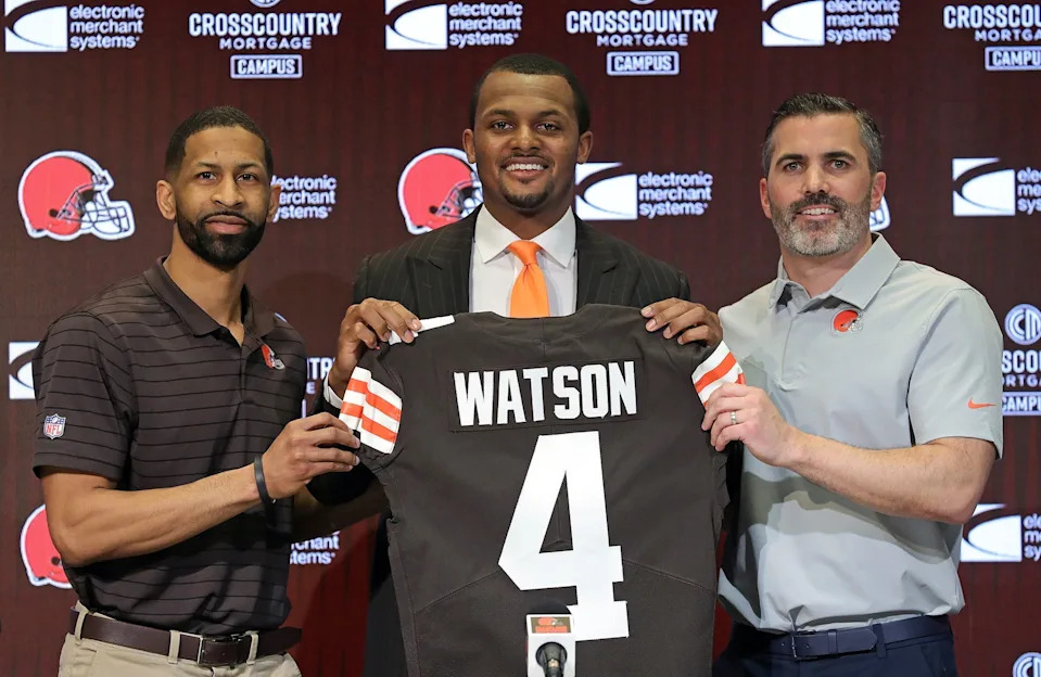 <p>Cleveland Browns quarterback Deshaun Watson, center, poses for a portrait with general manager Andrew Berry, left, and coach Kevin Stefanski during Watson’s introductory news conference March 26, 2022, in Berea.</p><br>