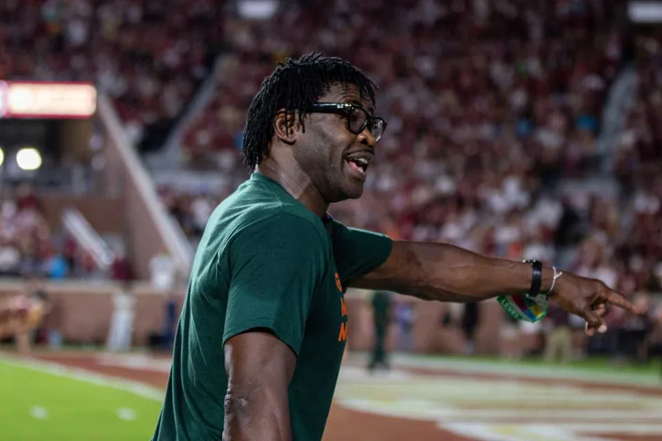 University of Miami Alumnus and wide receiver Michael Irvin points to where he made a play during his football career with the Hurricanes.© Audrey Shaw/FSView & Florida Flambeau / USA TODAY NETWORK via Imagn Images