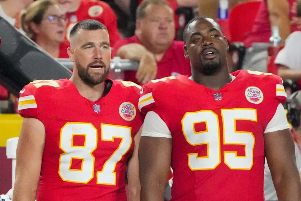 Aug 22, 2025; Kansas City, Missouri, USA; Kansas City Chiefs defensive end George Karlaftis (56) and quarterback Patrick Mahomes (15) and tight end Travis Kelce (87) and defensive tackle Chris Jones (95) watch play against the Chicago Bears during the second half of the game at GEHA Field at Arrowhead Stadium. Mandatory Credit: Denny Medley-Imagn Images