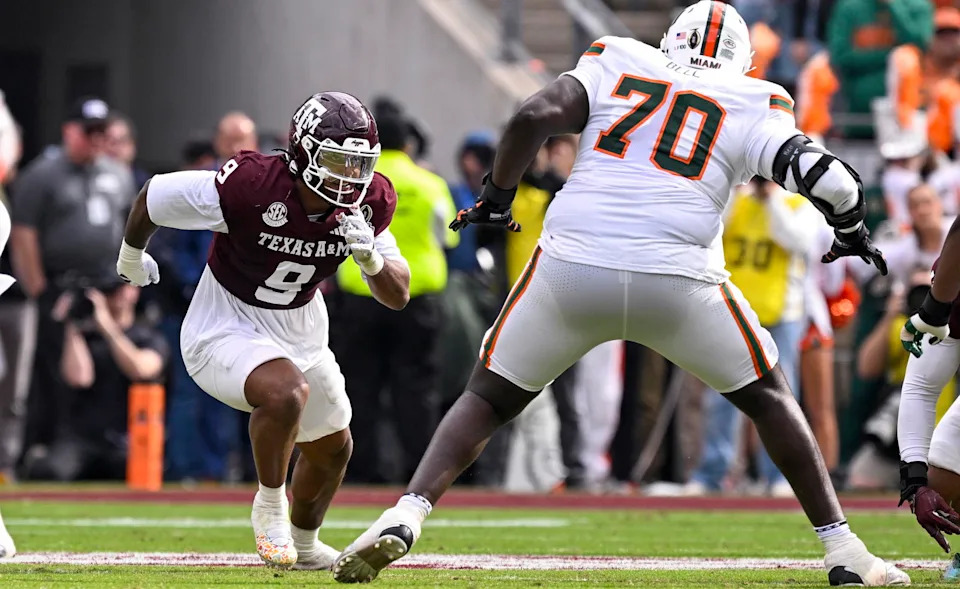 Texas A&M DE Cashius Howell rushes the line past Miami's Markel Bell as the Aggies host the Hurricanes in the College Football Playoffs on Dec. 20, 2025, in College Station, Texas. (Jerome Miron/Imagn Images)