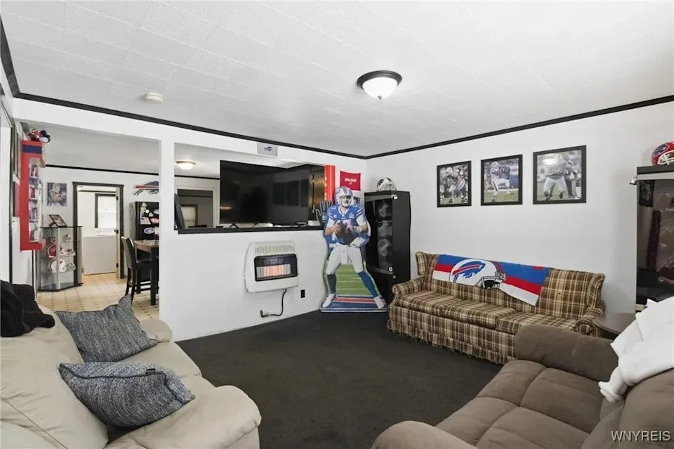 The 1,062-square-foot interior features all sorts of Bills memorabilia. <span class="image-credit">(Realtor.com)</span>