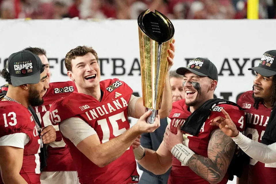 Indiana Hoosiers quarterback Fernando Mendoza (15) lifts the trophy after the College Football Playoff National Championship game against the Miami Hurricanes at Hard Rock Stadium. IMAGN IMAGES via Reuters Connect