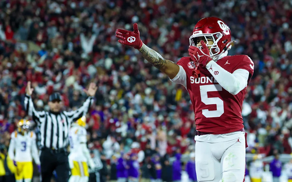 Nov 29, 2025; Norman, Oklahoma, USA; Oklahoma Sooners wide receiver Isaiah Sategna III (5) makes a touchdown catch during the fourth quarter against the Louisiana State Tigers at Gaylord Family-Oklahoma Memorial Stadium. Mandatory Credit: Kevin Jairaj-Imagn Images