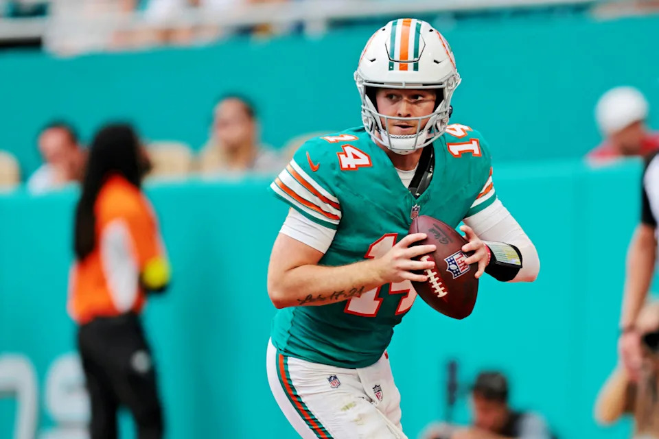 Dec 21, 2025; Miami Gardens, Florida, USA; Miami Dolphins quarterback Quinn Ewers (14) runs the ball during the fourth quarter against the Cincinnati Bengals at Hard Rock Stadium. Sam Navarro-Imagn Images