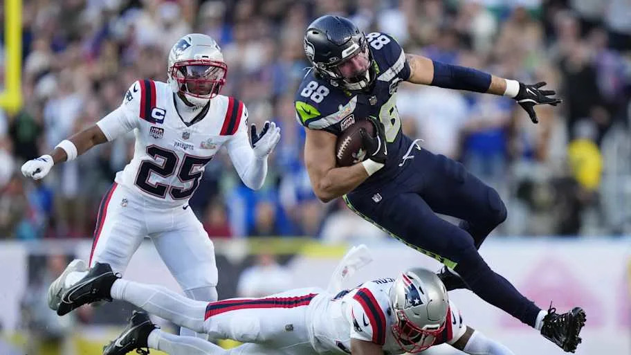 Seattle Seahawks tight end AJ Barner (88) makes a catch against New England Patriots safety Craig Woodson