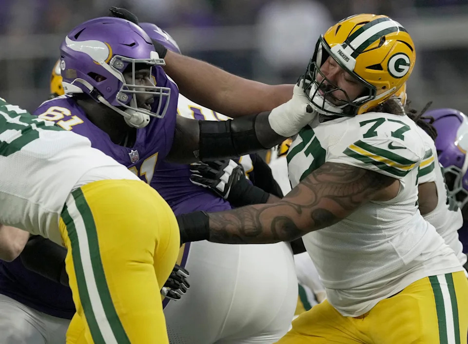 Green Bay Packers guard Jordan Morgan blocks Minnesota Vikings defensive tackle Jalen Redmond.