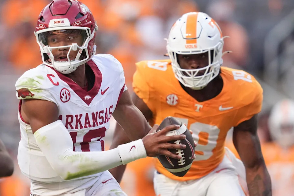 Arkansas quarterback Taylen Green (10) moves out of the pocket as Tennessee defensive lineman Joshua Josephs (19) approaches during an NCAA college football game on Oct. 11, 2025, in Knoxville, Tennessee.