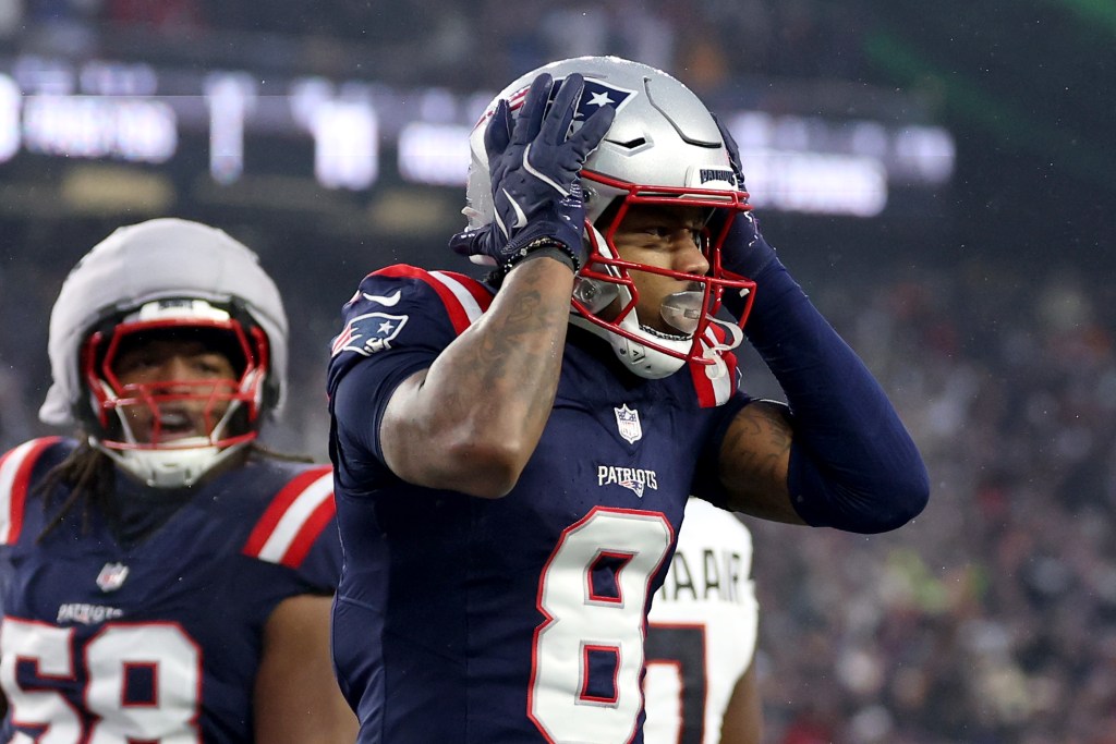 New England Patriots player Stefon Diggs #8 reacts after scoring a touchdown.