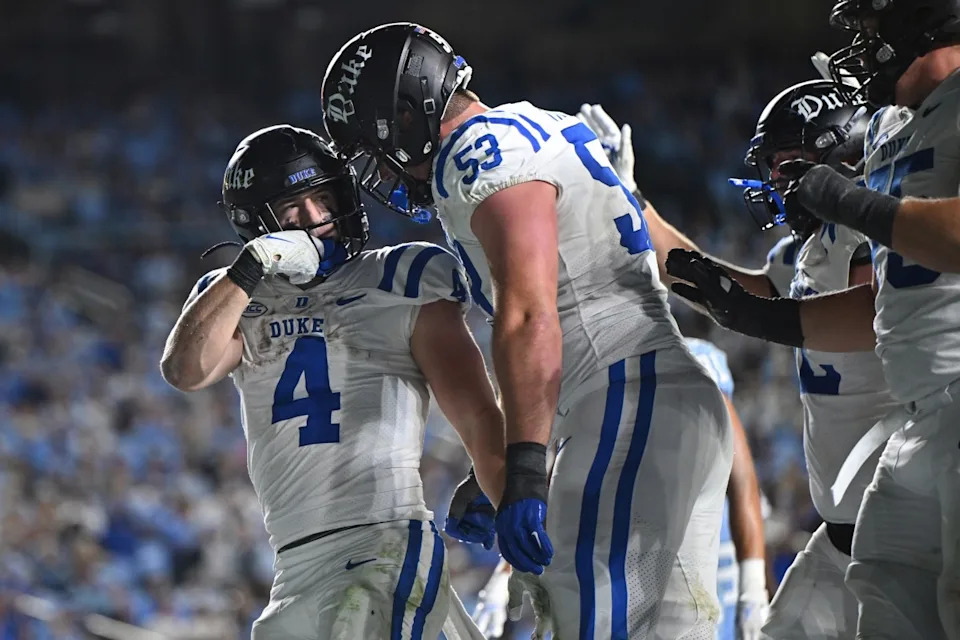 Nov 22, 2025; Chapel Hill, North Carolina, USA; Duke Blue Devils running back Anderson Castle (4) celebrates a touchdown with offensive lineman Brian Parker II (53) during the second half against North Carolina at Kenan Stadium. William Howard-Imagn Images