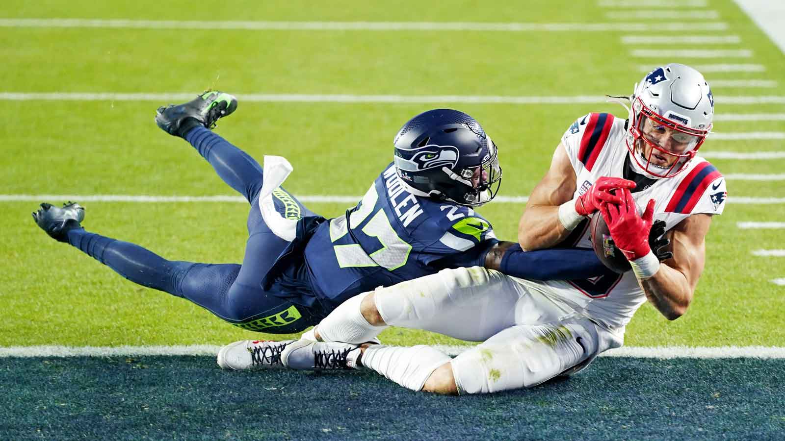 New England Patriots wide receiver Mack Hollins (13) makes a catch for a touchdown against Seattle Seahawks cornerback Riq Woolen (27) during the third quarter in Super Bowl LX at Levi's Stadium. Mandatory Credit: Cary Edmondson-Imagn Images