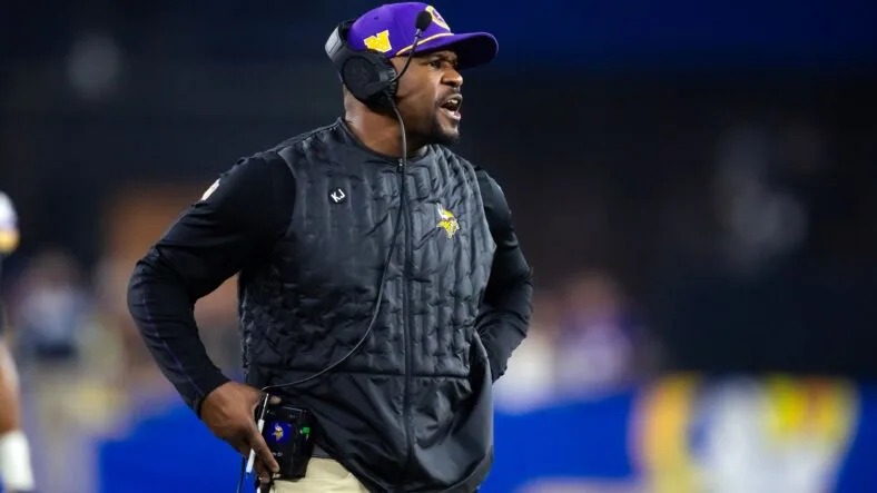 Jan 13, 2025; Glendale, AZ, USA; Minnesota Vikings defensive coordinator Brian Flores against the Los Angeles Rams during an NFC wild card game at State Farm Stadium. Mandatory Credit: Mark J. Rebilas-Imagn Images.
