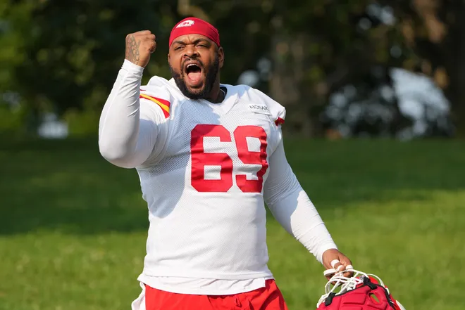 Jul 22, 2024; St. Joseph, MO, USA; Kansas City Chiefs defensive tackle Mike Pennel Jr. (69) gestures to fans while walking from the locker room to the fields prior to training camp at Missouri Western State University. Mandatory Credit: Denny Medley-USA TODAY Sports