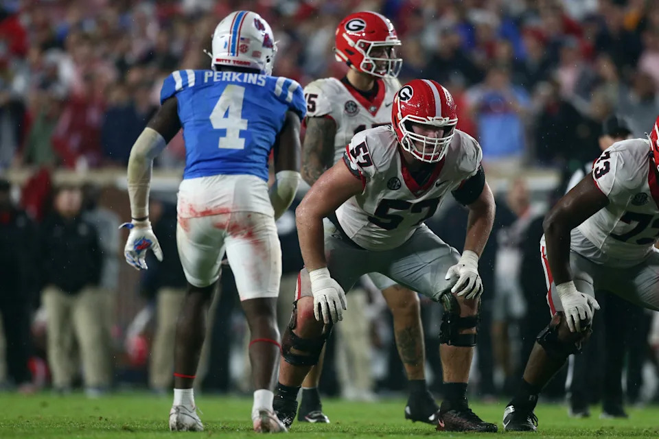 Georgia Bulldogs offensive lineman Monroe Freeling (57) waits for the snap.© Petre Thomas-Imagn Images