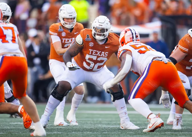 Dec 21, 2024; Austin, Texas, USA; Texas Longhorns offensive lineman DJ Campbell (52) against the Clemson Tigers during the CFP National playoff first round at Darrell K Royal-Texas Memorial Stadium. Mandatory Credit: Mark J. Rebilas-Imagn Images