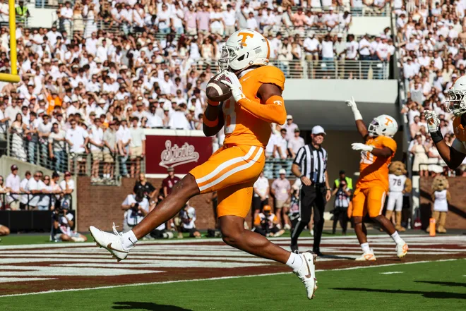 Sep 27, 2025; Starkville, Mississippi, USA; Tennessee Volunteers defensive back Colton Hood (8) scores a touchdown after an interception against the Mississippi State Bulldogs during the first half at Davis Wade Stadium at Scott Field. Mandatory Credit: Wesley Hale-Imagn Images