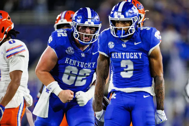 Nov 8, 2025; Lexington, Kentucky, USA; Kentucky Wildcats offensive lineman Jager Burton (62) celebrates after a drive by running back Seth McGowan (3) during the third quarter against the Florida Gators at Kroger Field. Mandatory Credit: Jordan Prather-Imagn Images