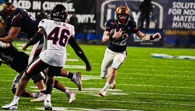 Navy’s Eli Heidenreich (22) rushes with the ball during the Liberty Bowl game against the Cincinnati Bearcats on Jan. 2, 2026 at Simmons Bank Liberty Stadium in Memphis, Tenn.