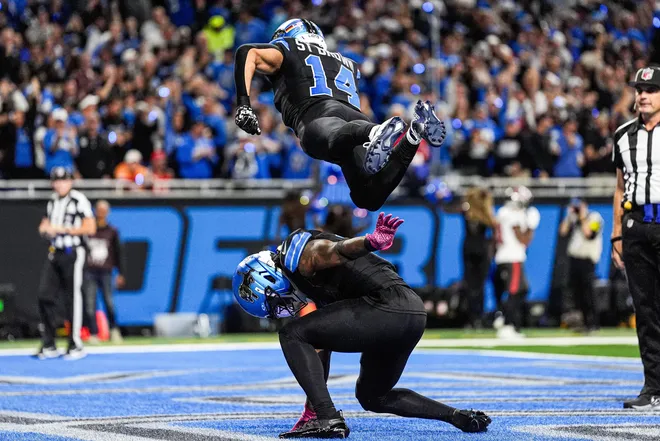 Detroit Lions running back Jahmyr Gibbs (0) celebrates a touchdown against the Tampa Bay Buccaneers with wide receiver Amon-Ra St. Brown (14) during the first half at Ford Field in Detroit on Monday, Oct. 20, 2025.