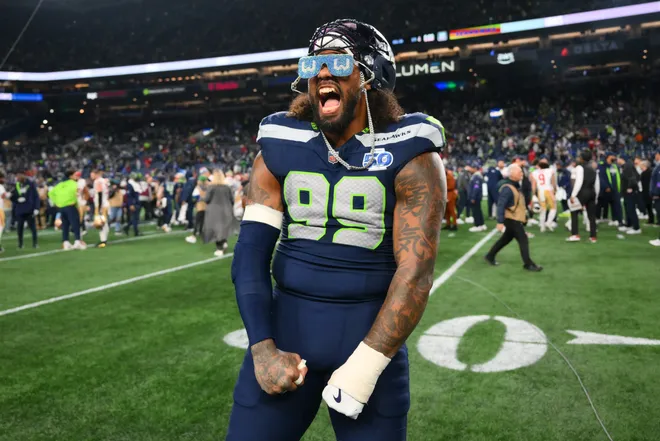 Jan 17, 2026; Seattle, WA, USA; Seattle Seahawks defensive end Leonard Williams (99) celebrates on the field following an NFC Divisional Round game against the San Francisco 49ers at Lumen Field. Mandatory Credit: Steven Bisig-Imagn Images