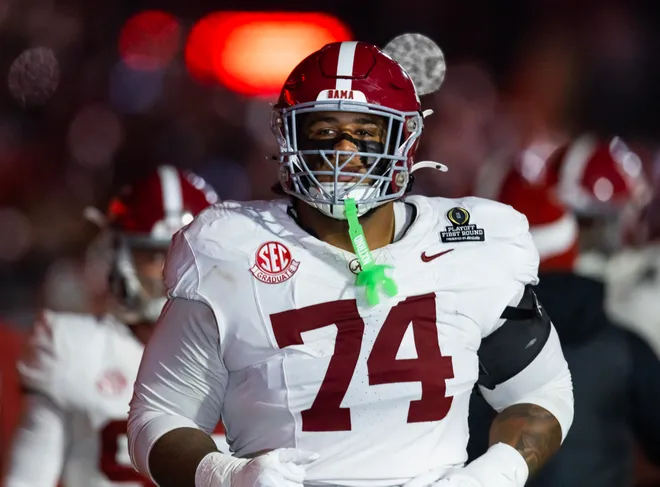 Dec 19, 2025; Norman, OK, USA; Alabama Crimson Tide offensive lineman Kadyn Proctor (74) against the Oklahoma Sooners during the CFP National Playoff First Round at Gaylord Family Oklahoma Memorial Stadium. Mandatory Credit: Mark J. Rebilas-Imagn Images