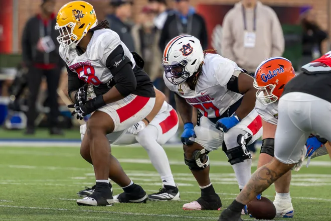 Jan 28, 2026; Mobile, AL, USA; American Team offensive lineman Max Iheanachor (58) of Arizona State and American Team offensive lineman Jeremiah Wright (77) of Auburn line up for a play during American Senior Bowl practice at Hancock Whitney Stadium. Mandatory Credit: Vasha Hunt-Imagn Images
