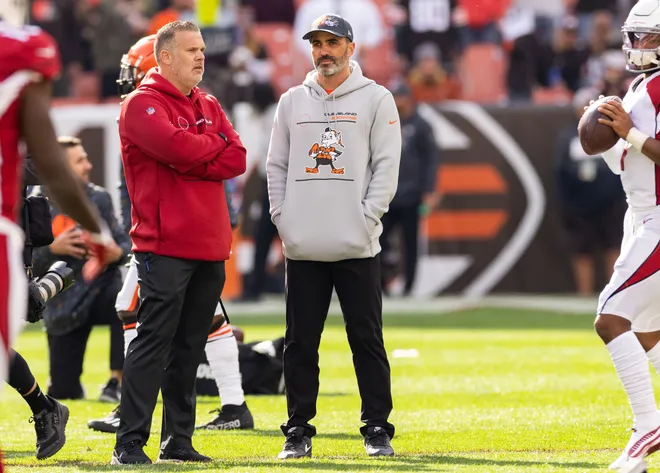 Oct 17, 2021; Cleveland, Ohio, USA; Arizona Cardinals assistant head coach Jeff Rogers talks with Cleveland Browns head coach Kevin Stefanski during warmups before the game at FirstEnergy Stadium. Mandatory Credit: Scott Galvin-USA TODAY Sports