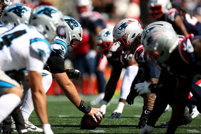 The Carolina Panthers' offense lines up against the New England Patriots' defense during the first half.