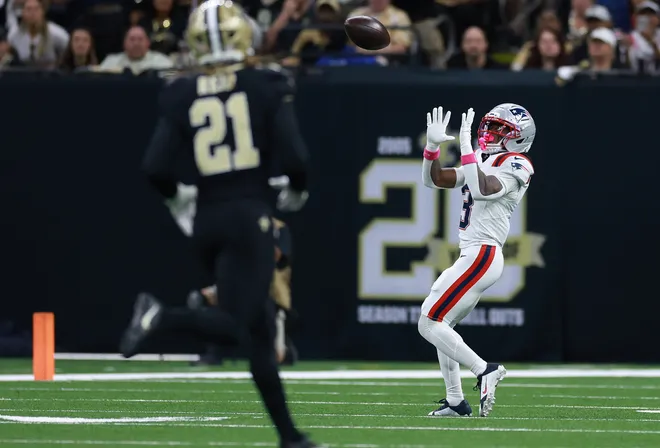 Demario Douglas of the New England Patriots makes a catch to score a touchdown during the game against the New Orleans Saints.