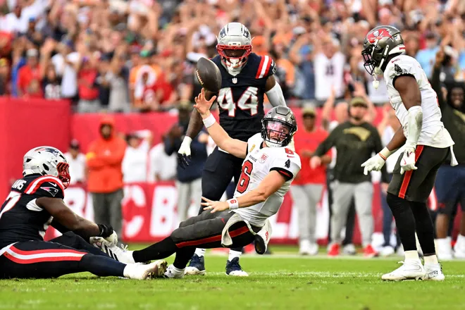 Tampa Bay Buccaneers quarterback Baker Mayfield throws the ball away during the fourth quarter against the New England Patriots.
