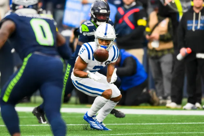 Dec 14, 2025; Seattle, Washington, USA; Indianapolis Colts wide receiver Josh Downs (2) catches a pass against the Seattle Seahawks during the first quarter at Lumen Field. Mandatory Credit: Steven Bisig-Imagn Images