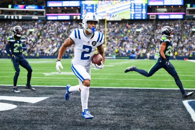 Dec 14, 2025; Seattle, Washington, USA; Indianapolis Colts wide receiver Josh Downs (2) runs into the end zone for a touchdown after catching a pass against the Seattle Seahawks during the second quarter at Lumen Field. Mandatory Credit: Steven Bisig-Imagn Images