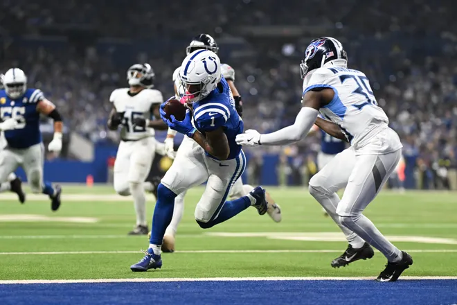Oct 26, 2025; Indianapolis, Indiana, USA; Indianapolis Colts wide receiver Josh Downs (1) makes a catch for a touchdown during the third quarter against the Tennessee Titans at Lucas Oil Stadium. Mandatory Credit: Robert Goddin-Imagn Images