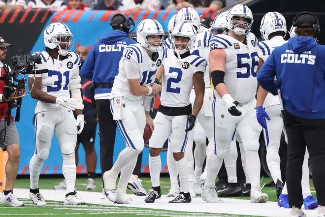 Jan 4, 2026; Houston, Texas, USA; Indianapolis Colts quarterback Riley Leonard (15) reacts with wide receiver Josh Downs (2) are scoring a touchdown against the Houston Texans during the second half at NRG Stadium. Mandatory Credit: Troy Taormina-Imagn Images
