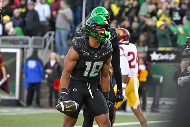 Nov 22, 2025; Eugene, Oregon, USA; Oregon Ducks tight end Kenyon Sadiq (18) celebrates against the Southern California Trojans during the second half at Autzen Stadium. Mandatory Credit: Troy Wayrynen-Imagn Images