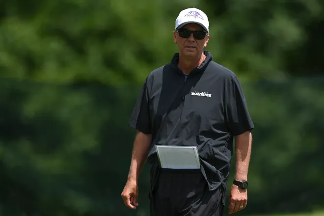Jul 27, 2024; Owings Mill , MD, USA; Baltimore Ravens offensive coordinator Todd Monken walks the field during the afternoon session of training camp at the Under Armour Performance Center, Mandatory Credit: Tommy Gilligan-USA TODAY Sports